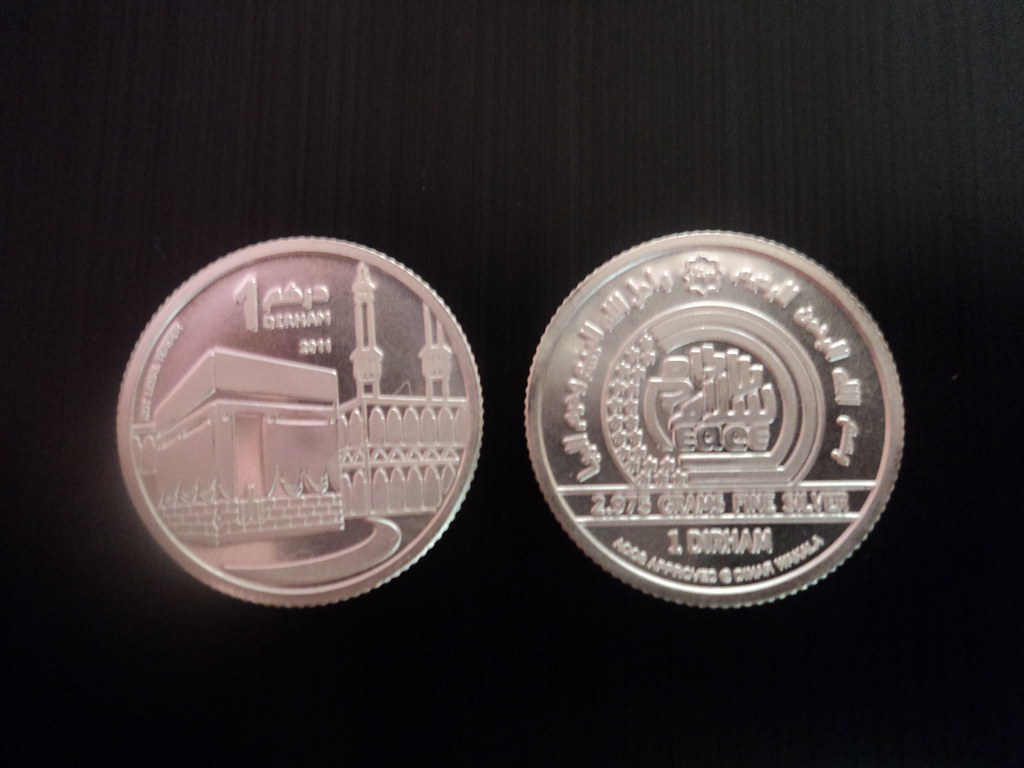 Dirhams on a black ground