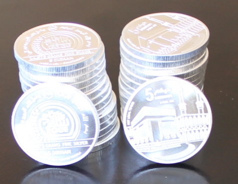 5 dirham coins, stacked